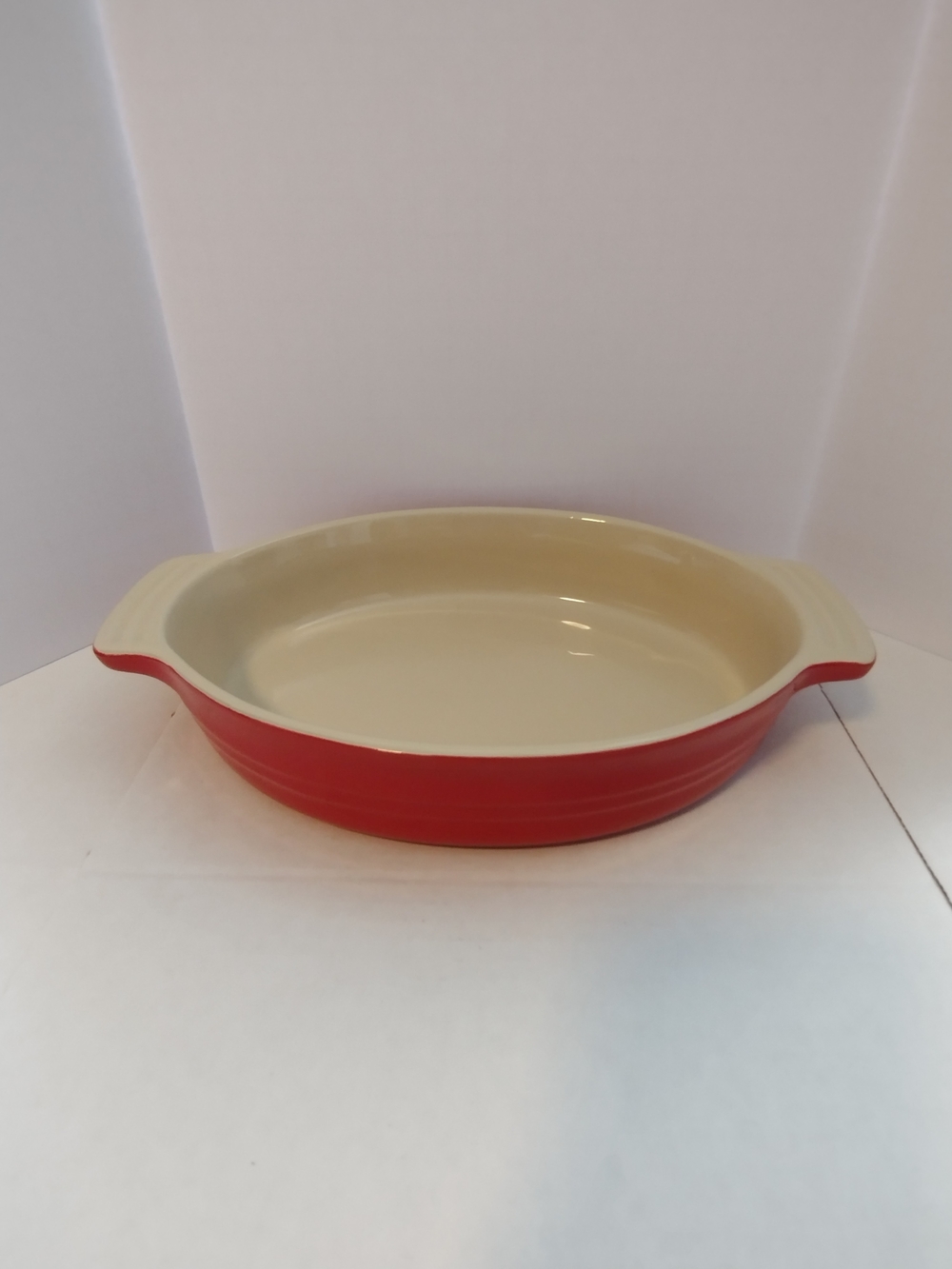 Le Creuset Red Ceramic Oval Baking Dish with Cream Interior
